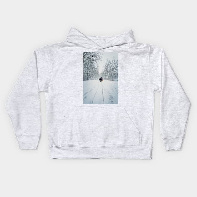 women walks the snowy street Kids Hoodie by psychoshadow